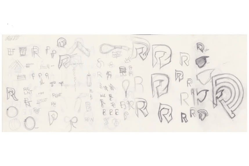 Early pencil sketches exploring the RSLNT monogram and visual identity.