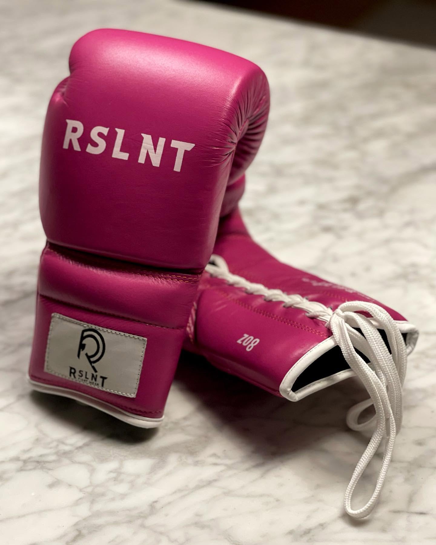Pink RSLNT boxing gloves photographed as a coordinated product set.